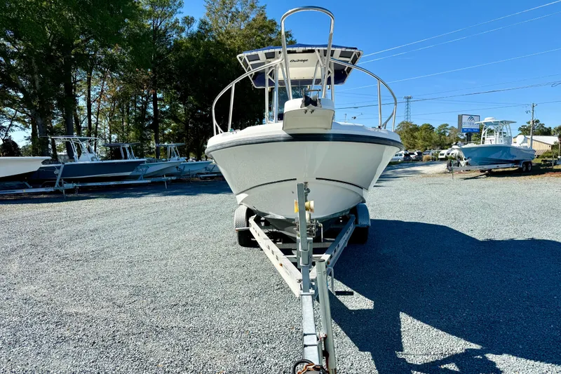 Slide: The Image of 2001 Boston Whaler 230 Outrage boat on trailer in outdoor lot. - 10