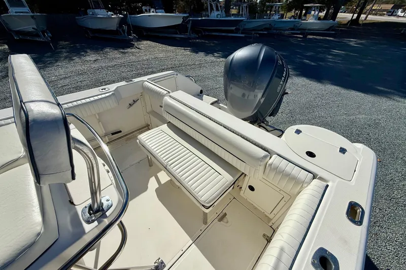 Slide: The Image of 2001 Boston Whaler 230 Outrage boat interior with seating and Yamaha outboard motor. - 17