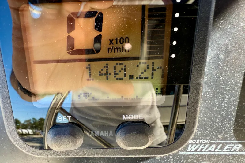 Slide: The Image of Close-up of a 2001 Boston Whaler 230 Outrage boat's digital display showing 148.2 hours. - 26