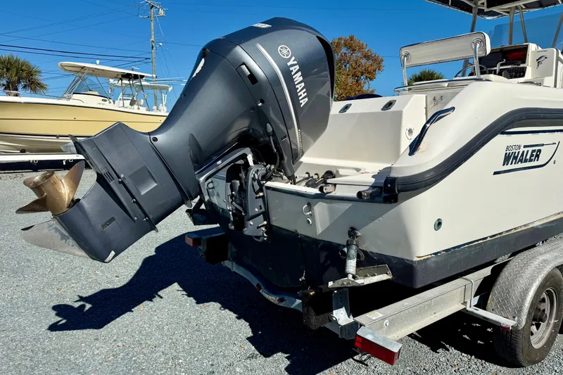 Slide: The Image of 2001 Boston Whaler 230 Outrage boat with Yamaha outboard motor on trailer. - 3