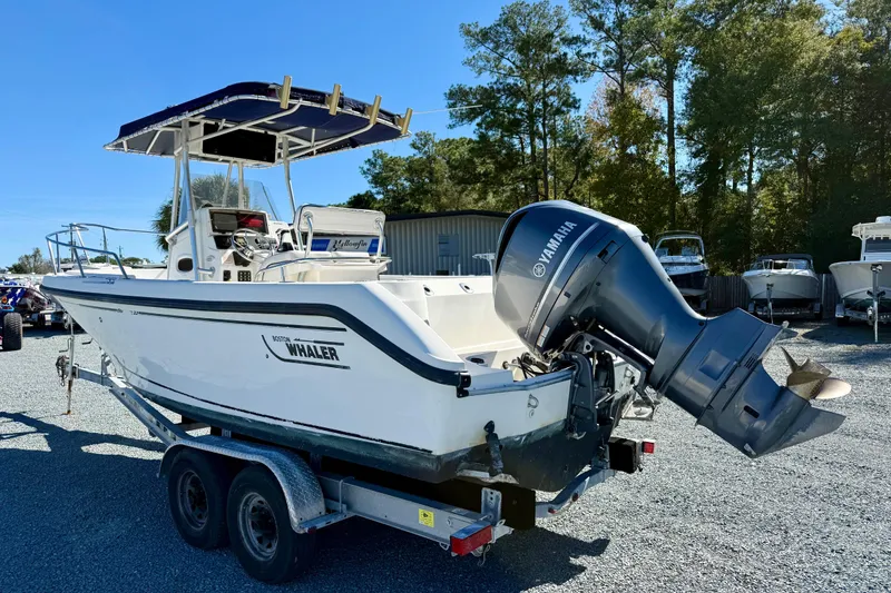 Slide: The Image of 2001 Boston Whaler 230 Outrage boat on trailer with Yamaha outboard motor. - 6