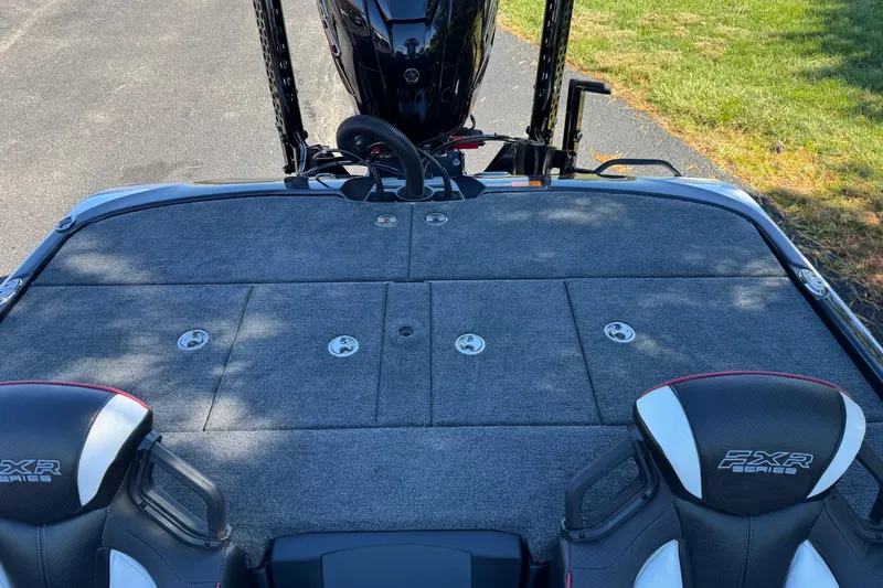 Slide: The Image of 2026 Skeee FXR 21 Flex boat deck with storage compartments and seating. - 10