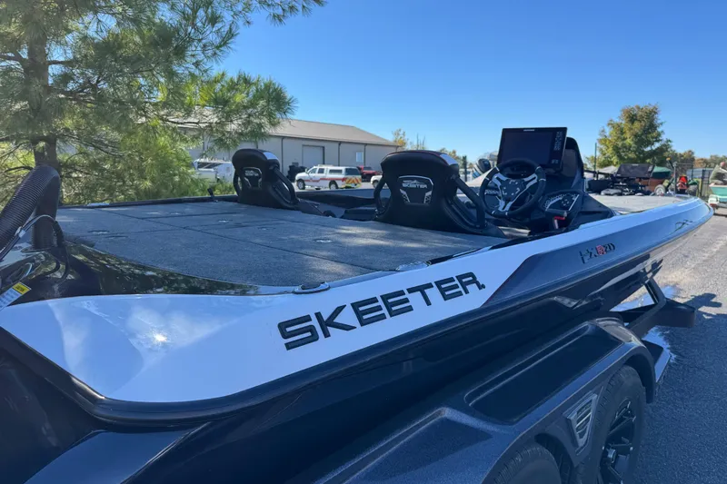Slide: The Image of 2026 Skeeter FXR 21 Flex boat with advanced dashboard and sleek design. - 13