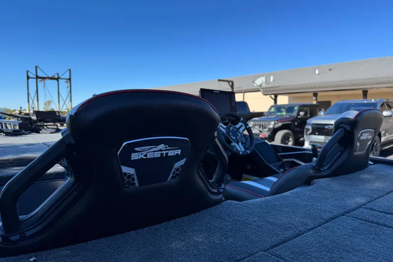 Slide: The Image of Interior of 2026 Skeeter FXR 21 Flex boat with sleek seating and steering wheel. - 4
