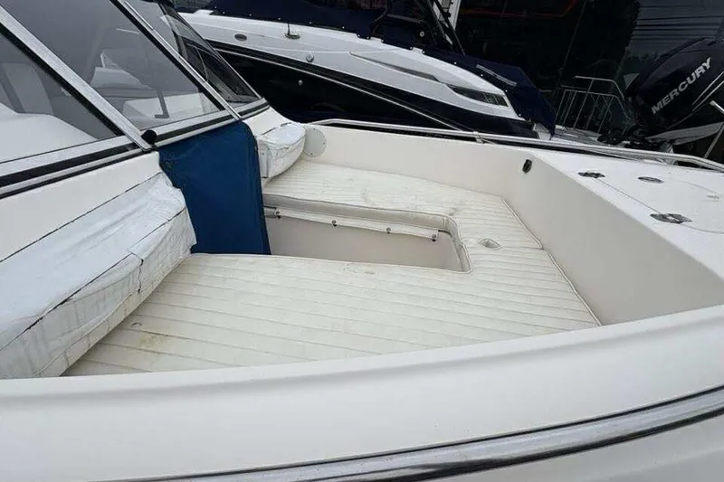 Slide: The Image of 2006 Key West 1720 Dual Console boat interior with seating and storage. - 10