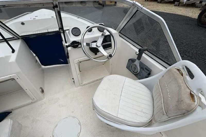 Slide: The Image of 2006 Key West 1720 Dual Console boat interior with steering wheel and seating. - 14