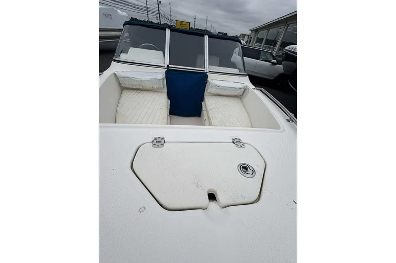 Slide: The Image of 2006 Key West 1720 Dual Console boat interior with seating and storage compartments. - 17