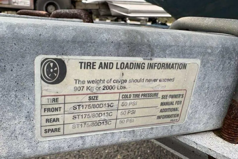 Slide: The Image of Tire and loading information label on a 2006 Key West 1720 Dual Console boat trailer. - 20
