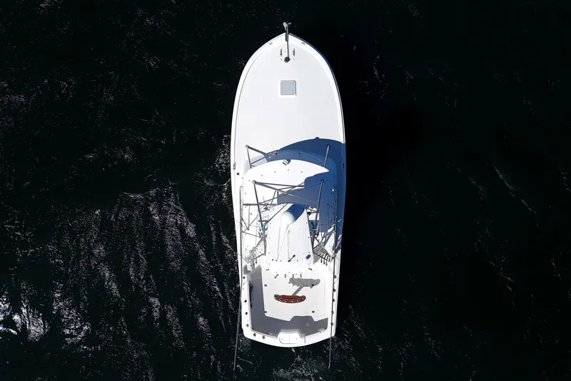 Slide: The Image of Aerial view of 2006 Out Island 38 Express boat on dark water. - 11
