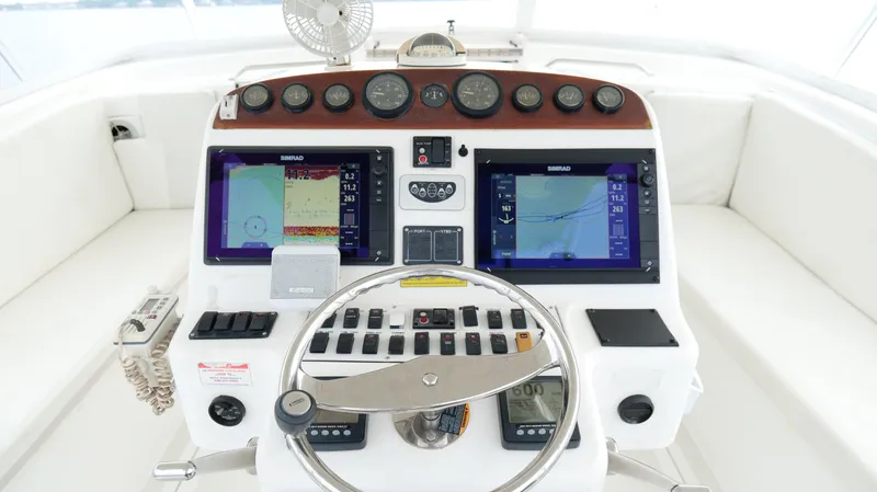 Slide: The Image of 2006 Out Island 38 Express helm with dual navigation screens and control panel. - 14