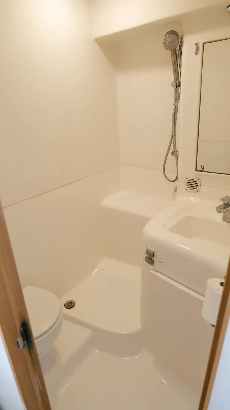 Slide: The Image of 2006 Out Island 38 Express yacht bathroom with shower and sink. - 29