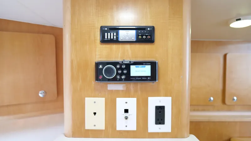 Slide: The Image of Control panel and outlets on 2006 Out Island 38 Express boat interior. - 30