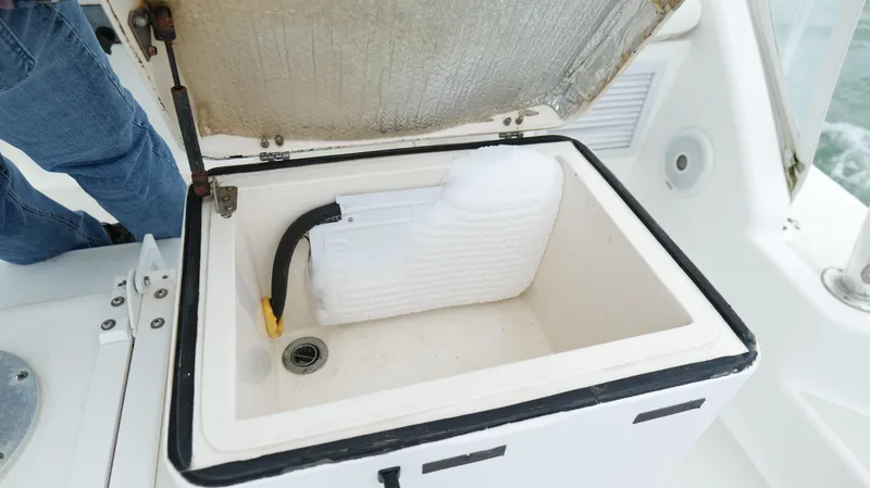 Slide: The Image of Open cooler compartment on 2006 Out Island 38 Express boat. - 33