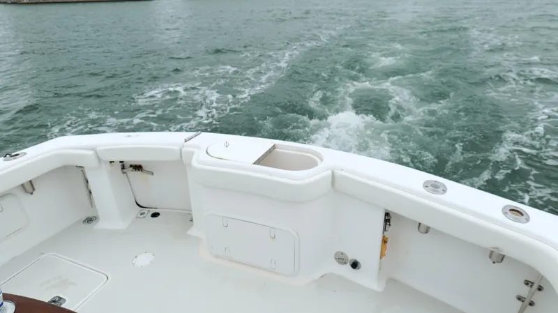 Slide: The Image of 2006 Out Island 38 Express boat stern view on open water. - 34