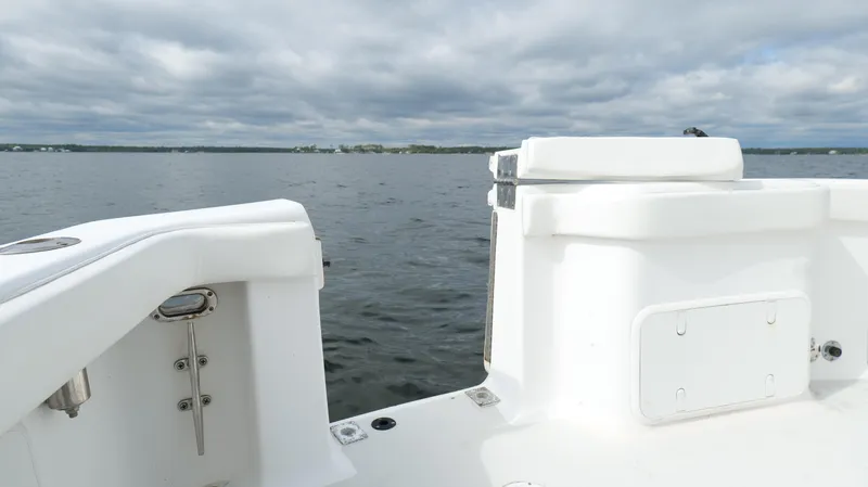 Slide: The Image of 2006 Out Island 38 Express boat on calm water under cloudy skies. - 36
