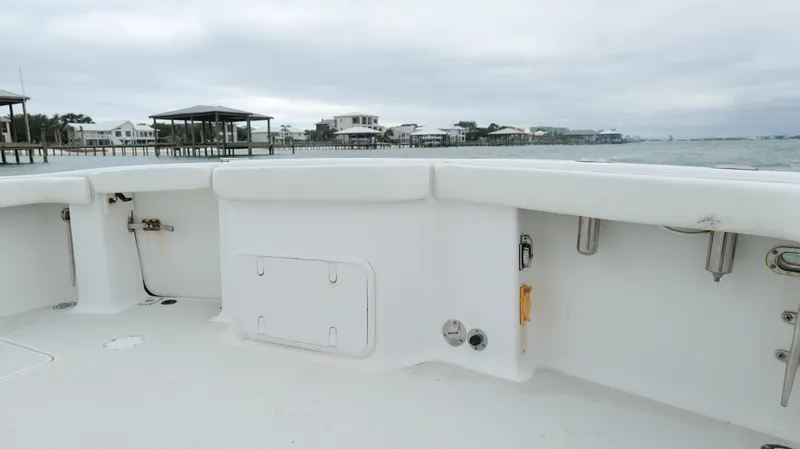 Slide: The Image of 2006 Out Island 38 Express boat deck with coastal view, overcast sky. - 37