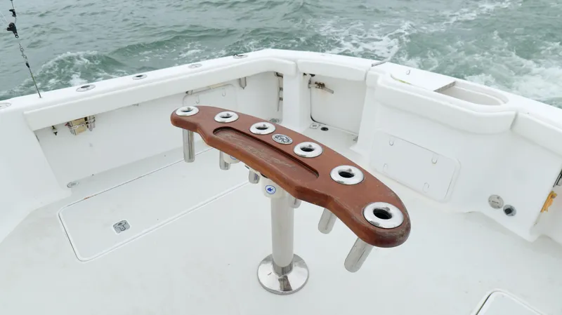 Slide: The Image of Out Island 38 Express 2006 boat deck with fishing rod holders. - 38