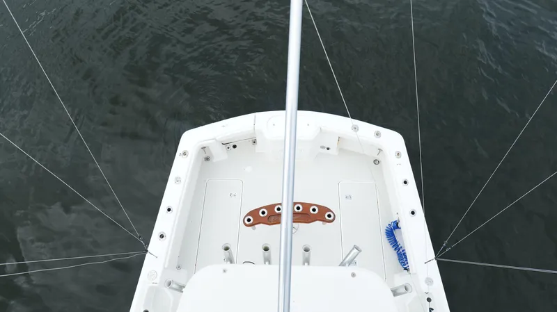 Slide: The Image of Top view of 2006 Out Island 38 Express boat deck on water. - 39