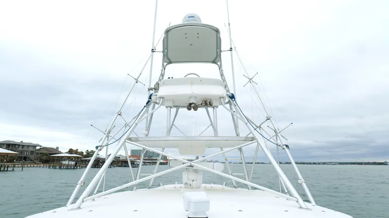 Slide: The Image of 2006 Out Island 38 Express boat on water, featuring a sturdy tower structure. - 41