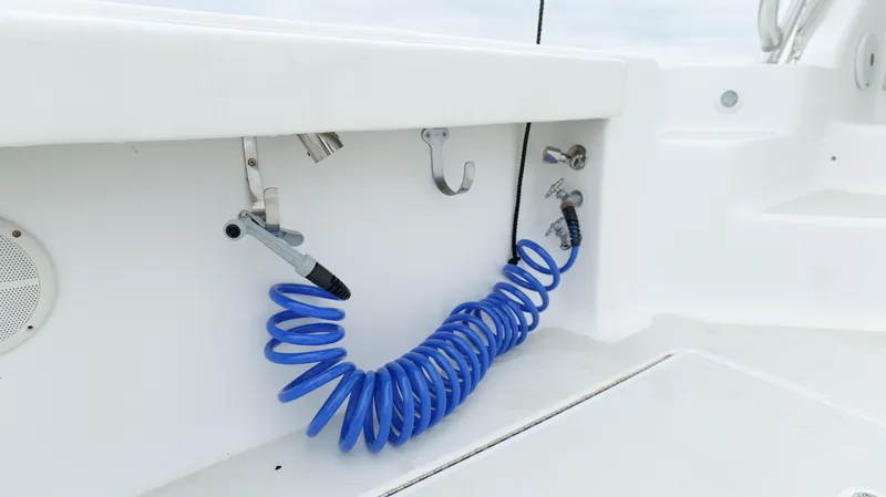 Slide: The Image of Blue coiled hose on 2006 Out Island 38 Express boat deck. - 45