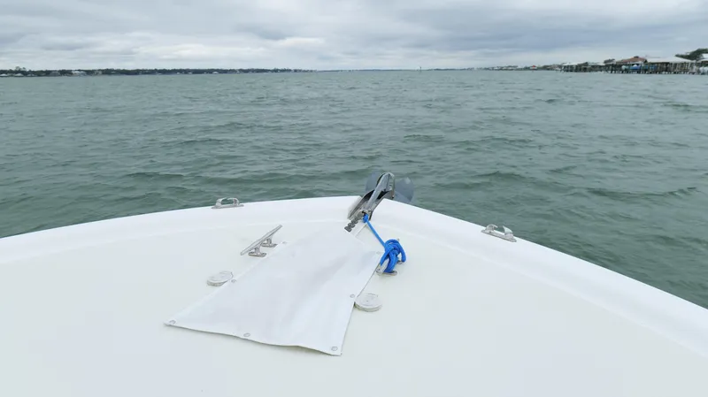 Slide: The Image of Bow of 2006 Out Island 38 Express boat on open water under cloudy skies. - 48