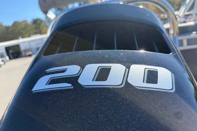 Slide: The Image of Close-up of a 200 horsepower engine on a 2026 Tahoe Pontoon LTZ Quad Lounger. - 3