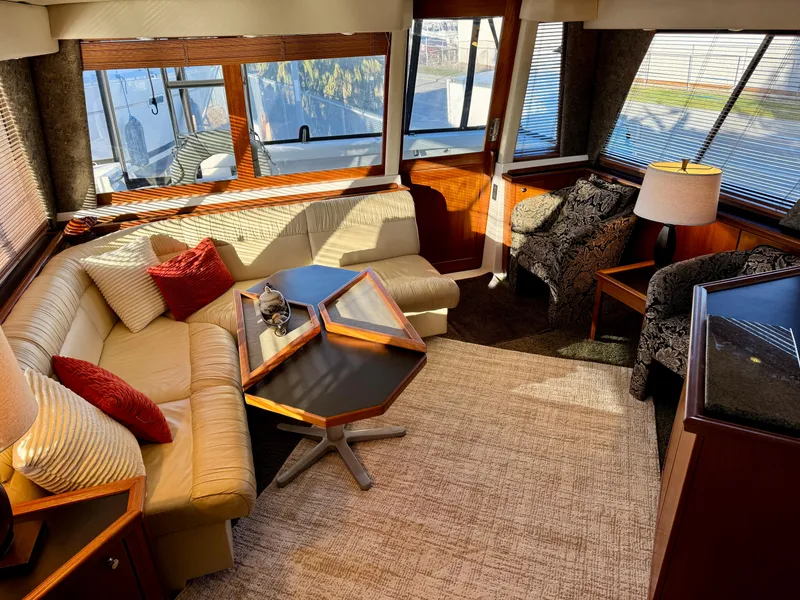 Slide: The Image of Luxurious interior of 1994 Bayliner 4788 Pilot House Motoryacht with plush seating and elegant decor. - 10