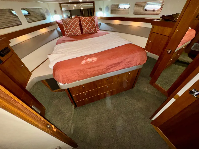 Slide: The Image of Cozy bedroom in 1994 Bayliner 4788 Pilot House Motoryacht with elegant wood finish. - 14