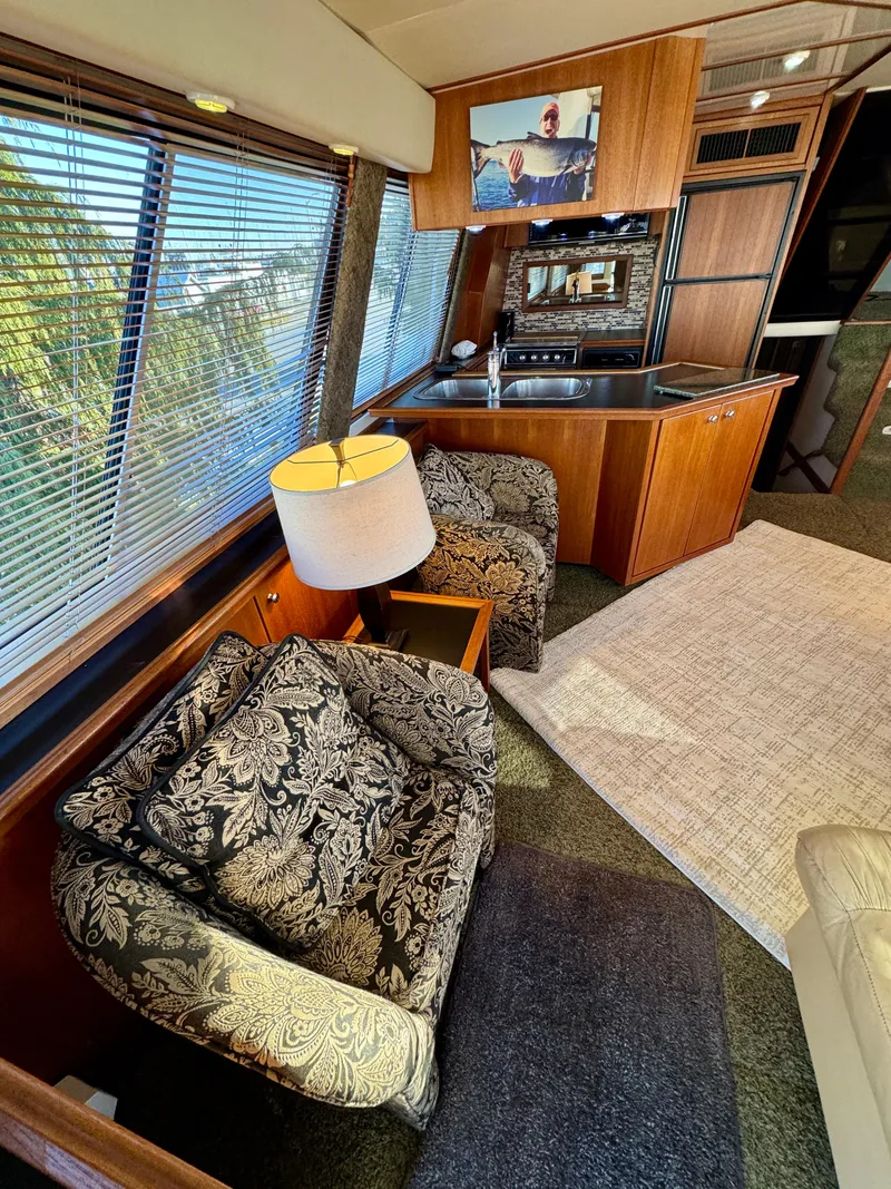 Slide: The Image of Luxurious interior of 1994 Bayliner 4788 Pilot House Motoryacht with elegant seating and modern amenities. - 7