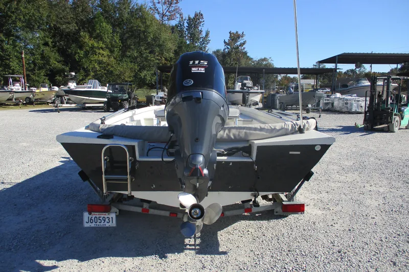 Slide: The Image of 2018 Ranger RB190 Bay boat with outboard motor in a gravel lot. - 7