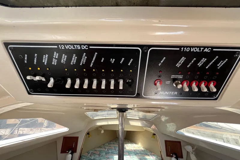 Slide: The Image of Electrical control panel inside a 1994 Hunter 29.5 sailboat cabin. - 29