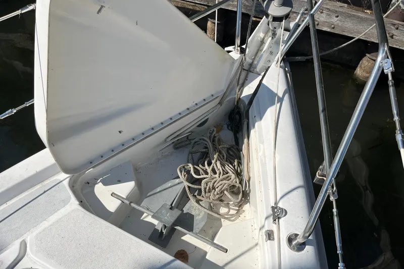 Slide: The Image of Anchor locker of a 1994 Hunter 29.5 sailboat with ropes and anchor. - 5