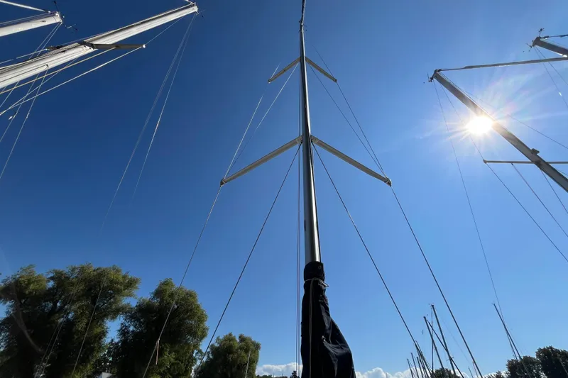 Slide: The Image of Sailboat mast of 1994 Hunter 29.5 against clear blue sky and sun. - 8