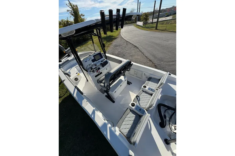 Slide: The Image of 2024 NauticStar 231 Hybrid boat interior with modern console and seating. - 8