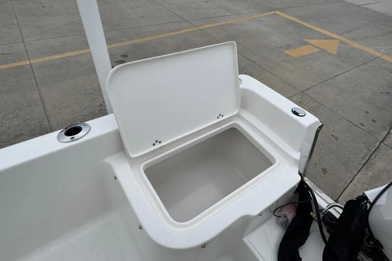 Slide: The Image of Open storage compartment on 2026 Key West 1720 Center Console boat. - 16
