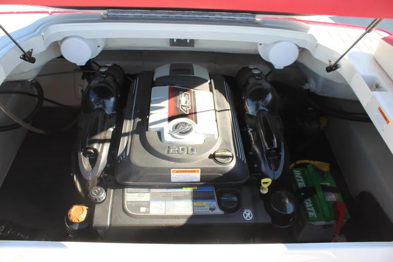 Slide: The Image of 2019 Crownline 205 SS boat engine compartment with 4.5L 200 HP engine. - 13