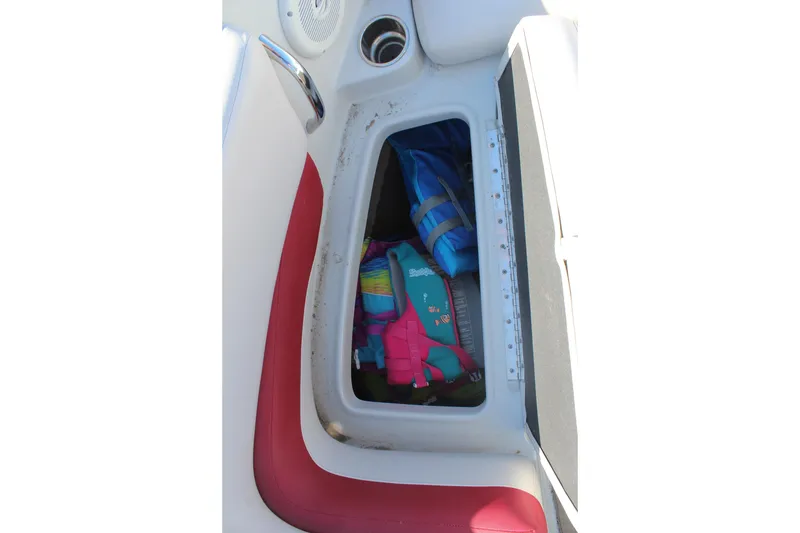 Slide: The Image of Storage compartment in 2019 Crownline 205 SS boat with life jackets inside. - 23