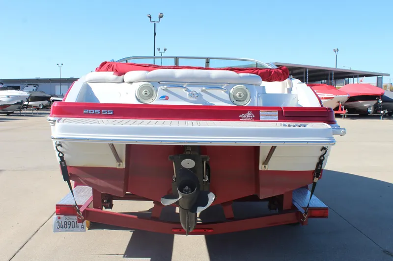 Slide: The Image of 2019 Crownline 205 SS boat, red and white, rear view on trailer. - 6
