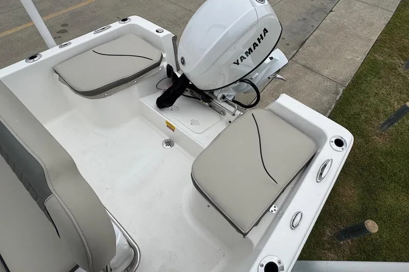 Slide: The Image of 2026 Key West 1720 Center Console boat with Yamaha engine, featuring cushioned seating. - 14