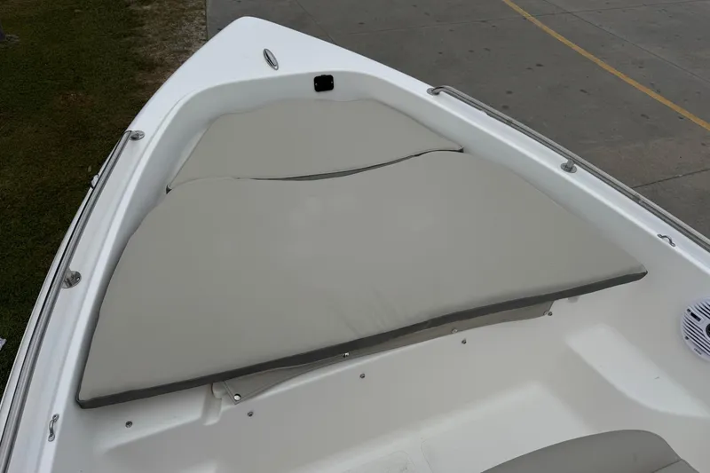 Slide: The Image of 2026 Key West 1720 Center Console boat with cushioned seating area. - 5