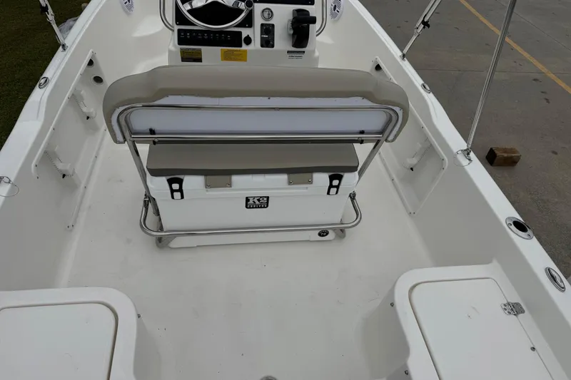 Slide: The Image of 2026 Key West 1720 Center Console boat interior with seating and steering console. - 17