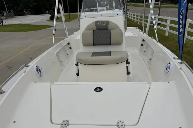 Slide: The Image of 2026 Key West 1720 Center Console boat interior with cushioned seating and speakers. - 18