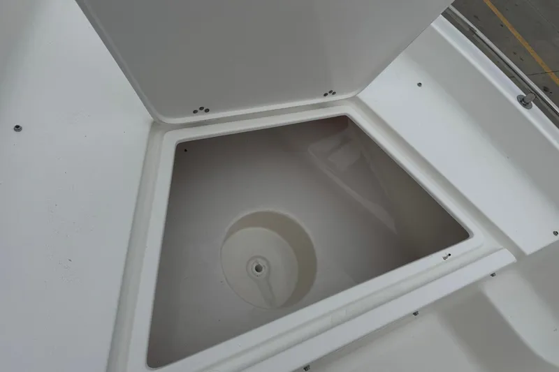 Slide: The Image of Open storage compartment on 2026 Key West 1720 Center Console boat. - 7
