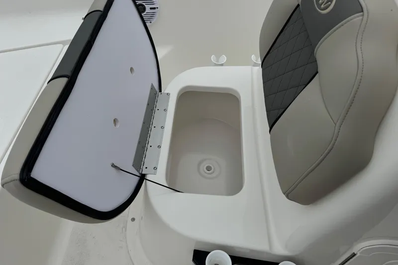 Slide: The Image of 2026 Key West 1720 Center Console boat seat with storage compartment open. - 9