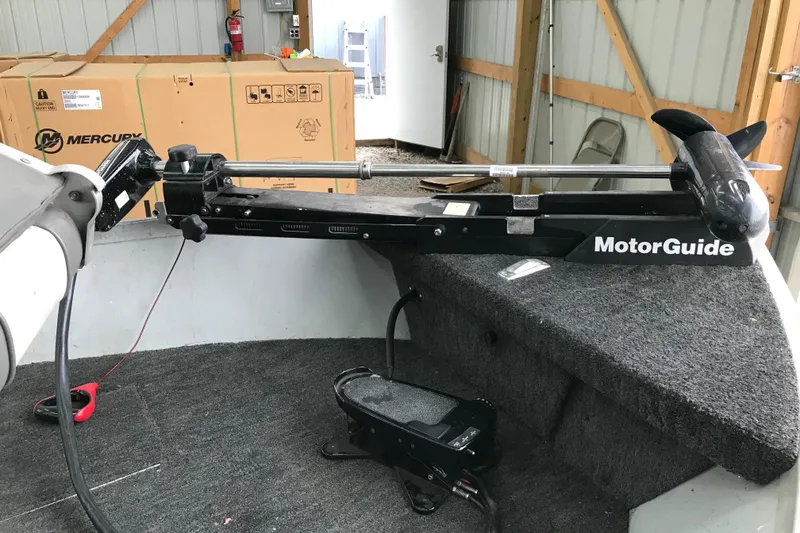 Slide: The Image of 1995 Alumacraft Lunker 165 LTD boat with MotorGuide trolling motor in a garage. - 6