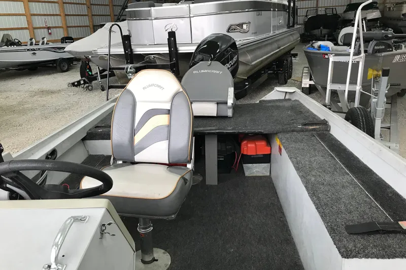 Slide: The Image of 1995 Alumacraft Lunker 165 LTD boat interior with steering wheel and seating. - 8