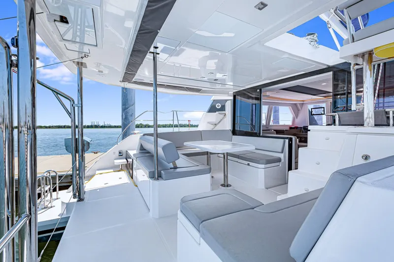 Slide: The Image of Luxurious 2023 Leopard 42 yacht interior with modern seating and dining area. - 11