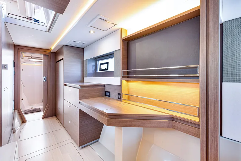 Slide: The Image of Luxurious interior of 2023 Leopard 42 yacht with modern wood finishes and ambient lighting. - 21