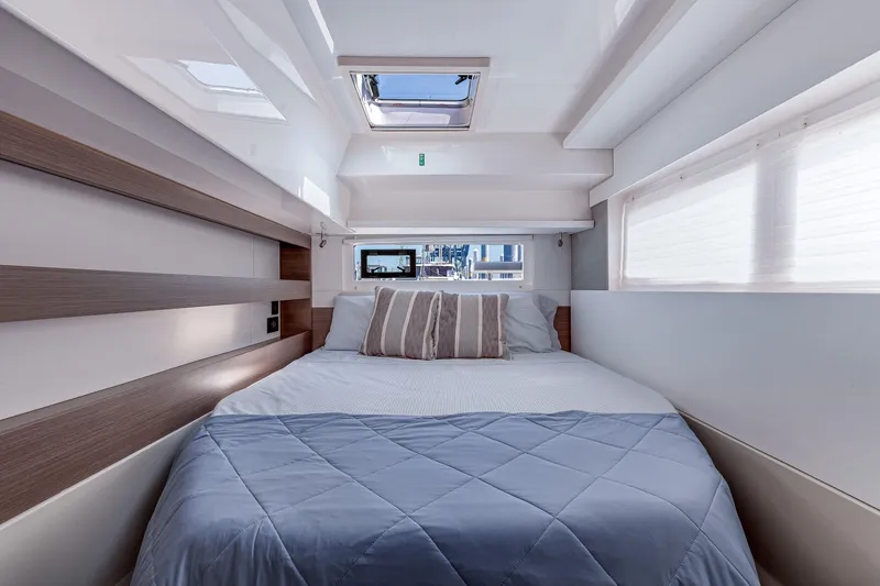 Slide: The Image of Luxurious cabin interior of 2023 Leopard 42 yacht with skylight and cozy bedding. - 23