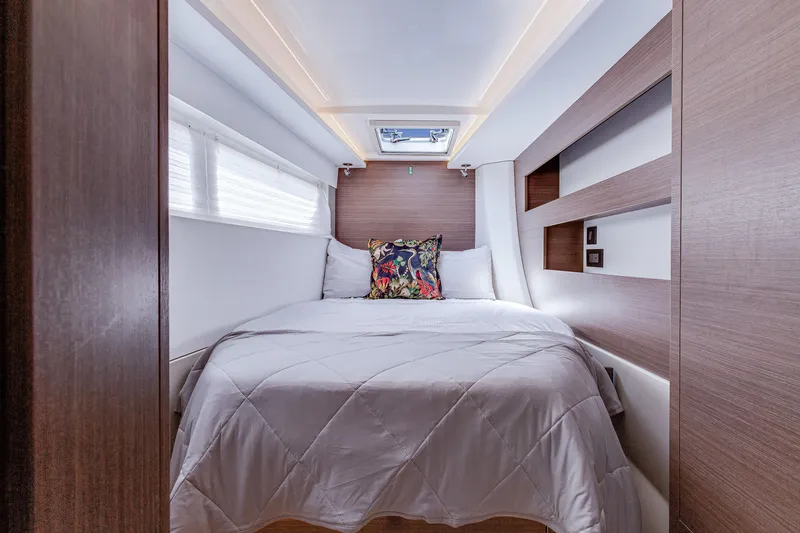 Slide: The Image of Luxurious bedroom interior of 2023 Leopard 42 yacht with modern design and cozy bedding. - 25